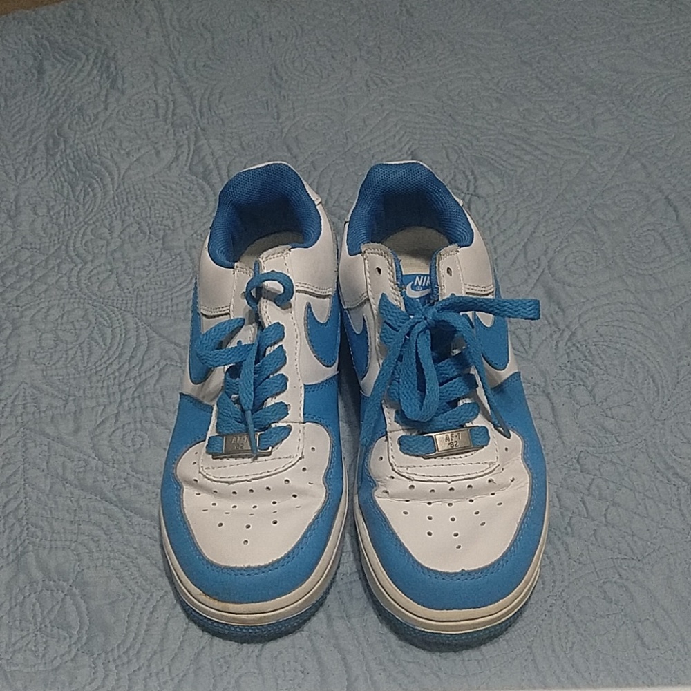 Blue and white Nike Air Force 1s